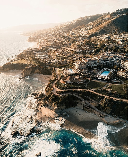 Coastal view of residential area and beach.
