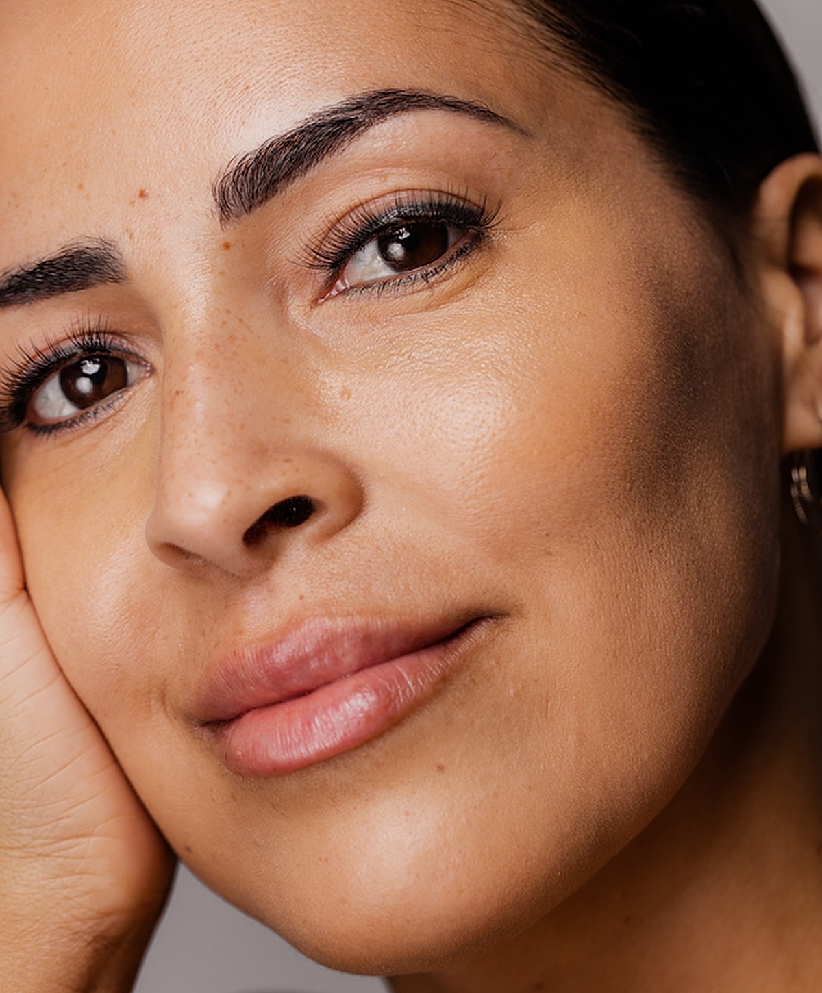 Close-up of a woman's face and smile.