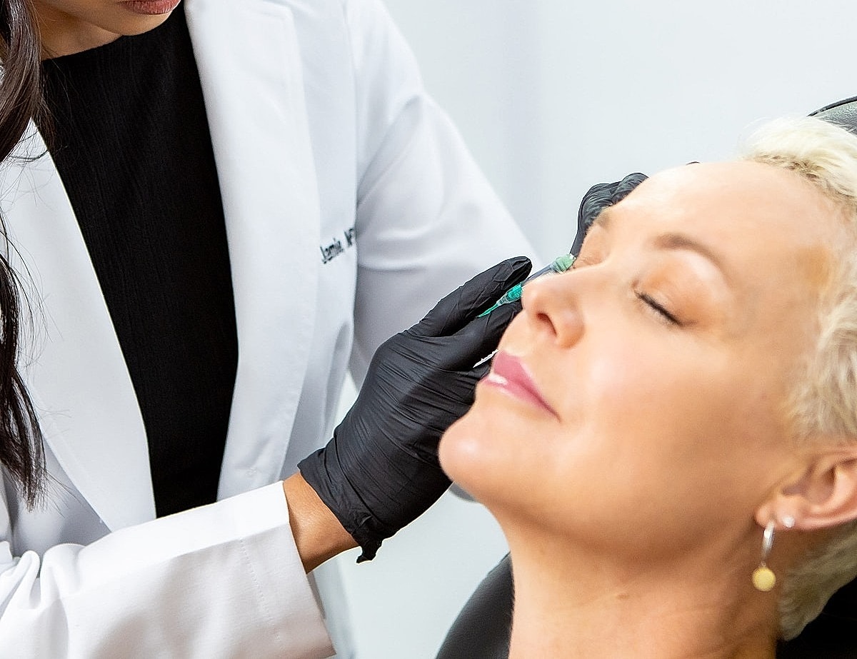 Close-up of a woman's face and smile.