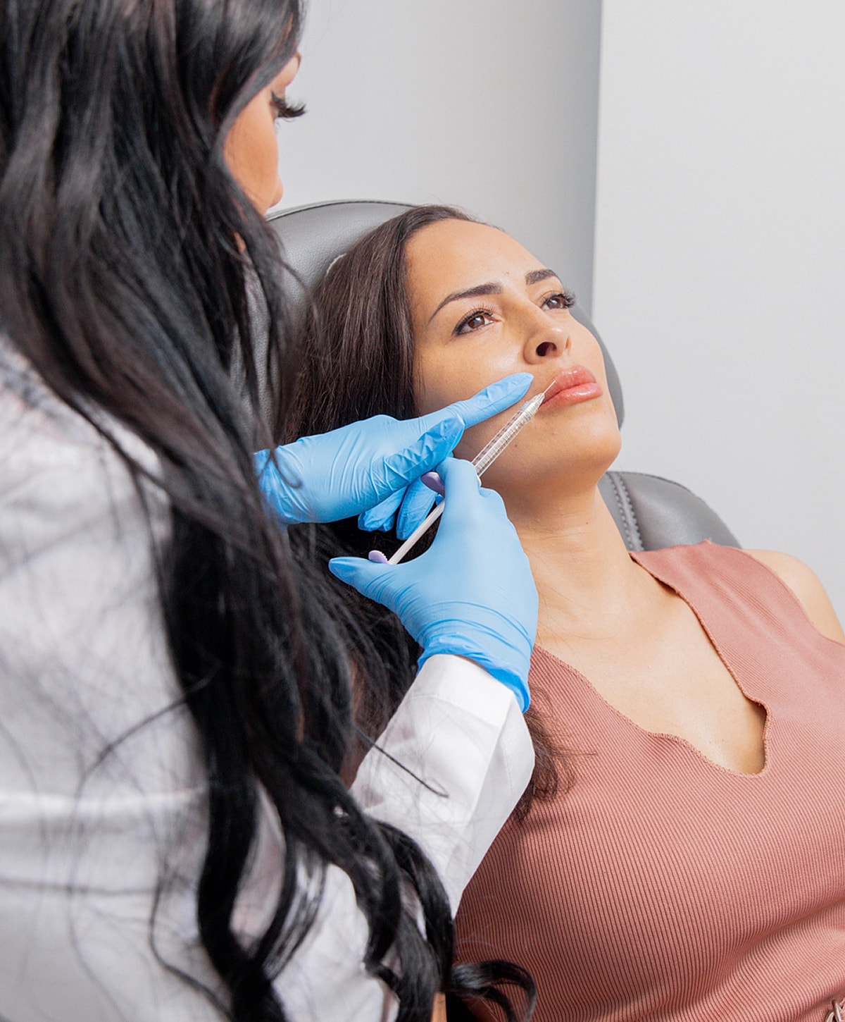 Close-up of a woman's face and smile.