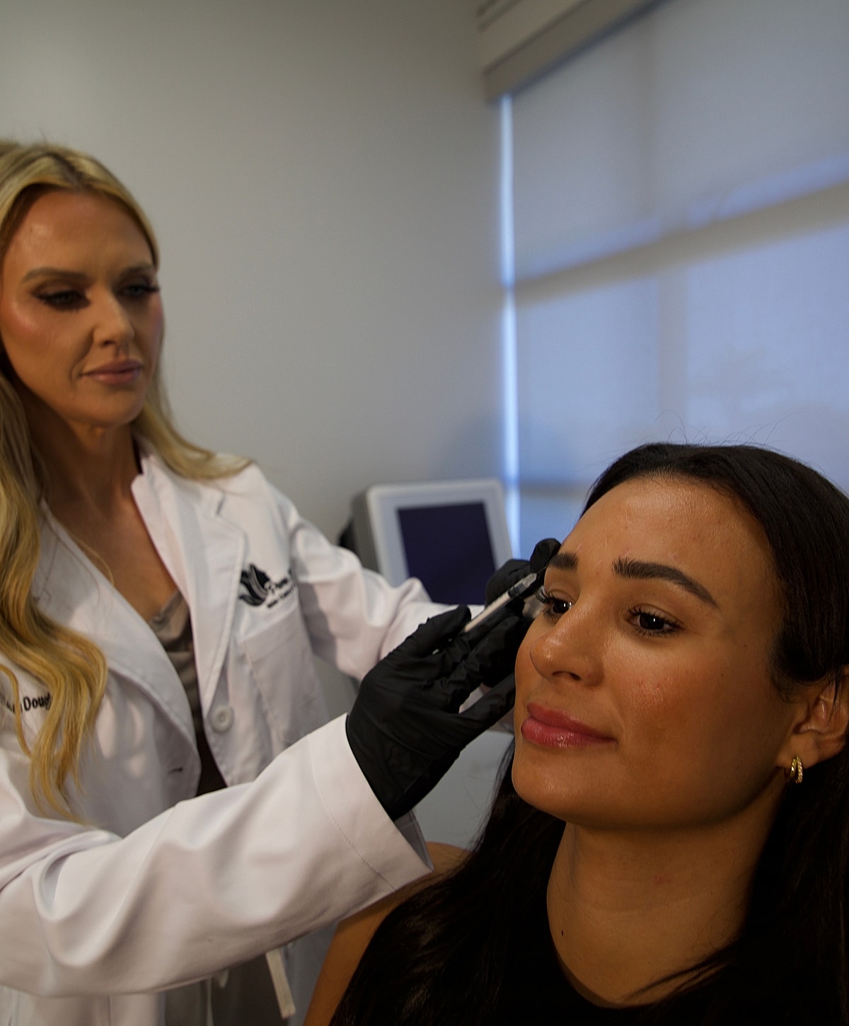 Close-up of a woman's face and smile.