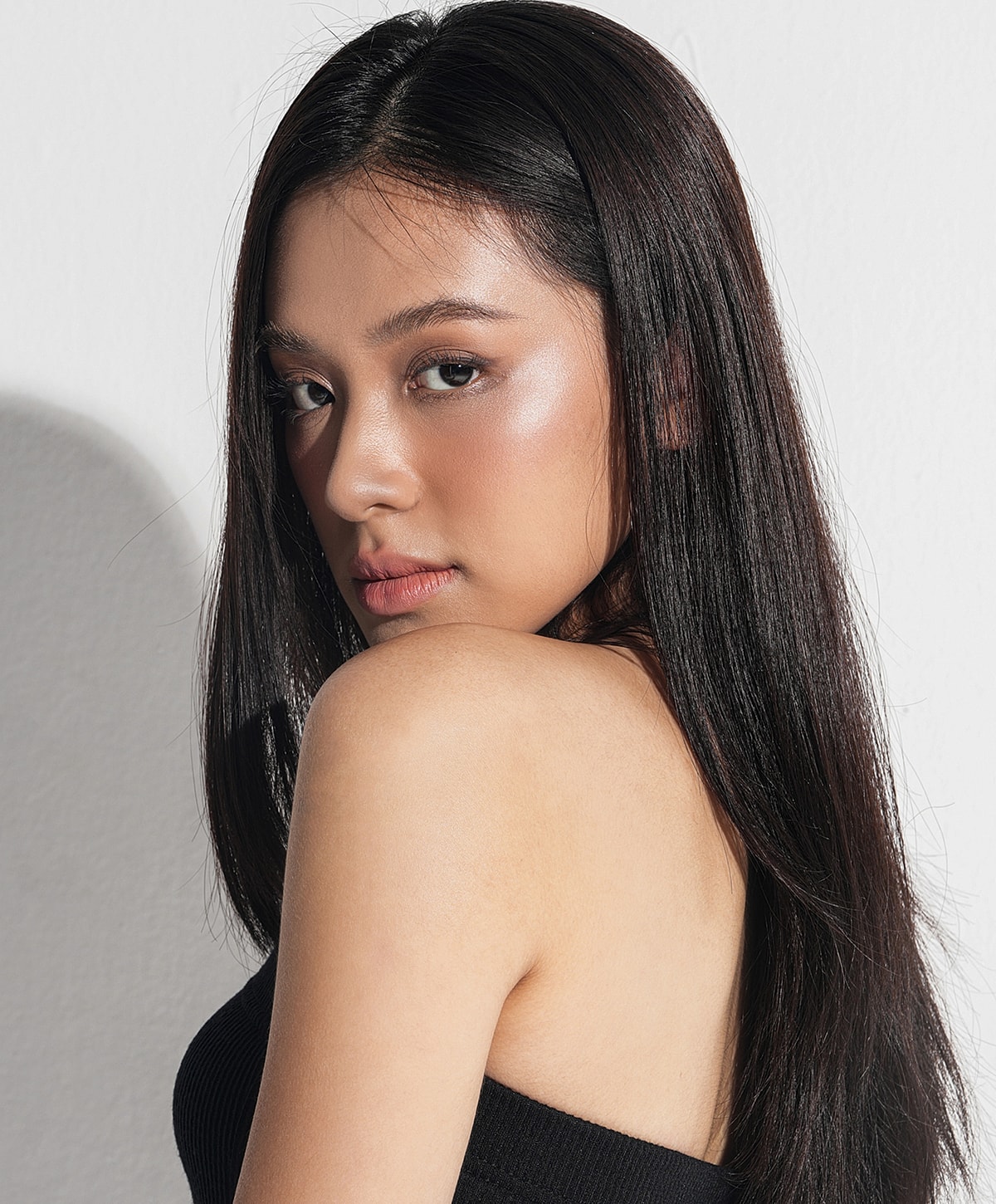 Close-up of a woman's face and smile.