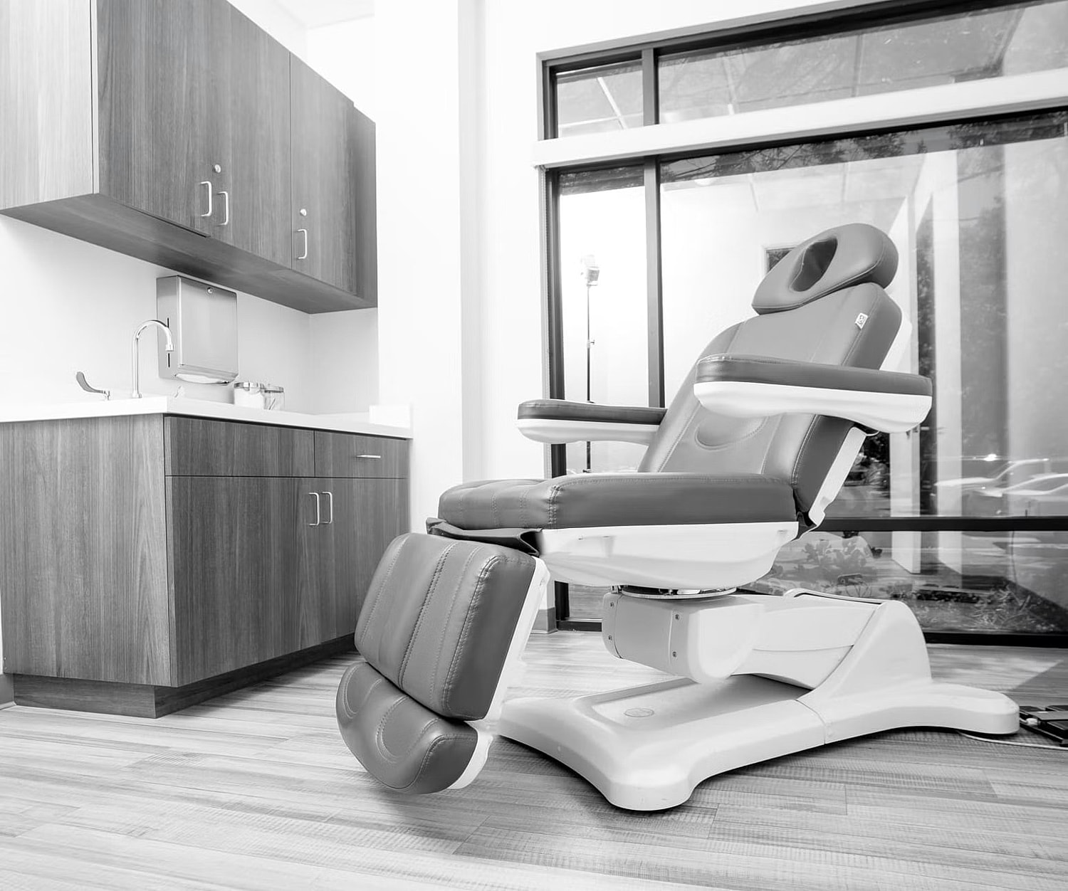 Modern dental chair in bright clinic setting.