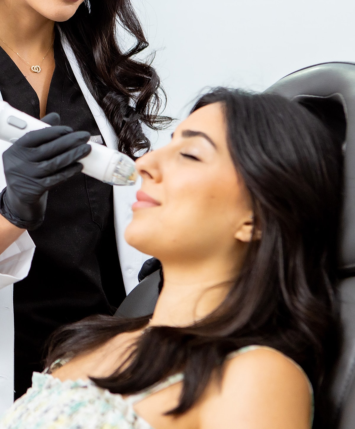 Close-up of a woman's face and smile.