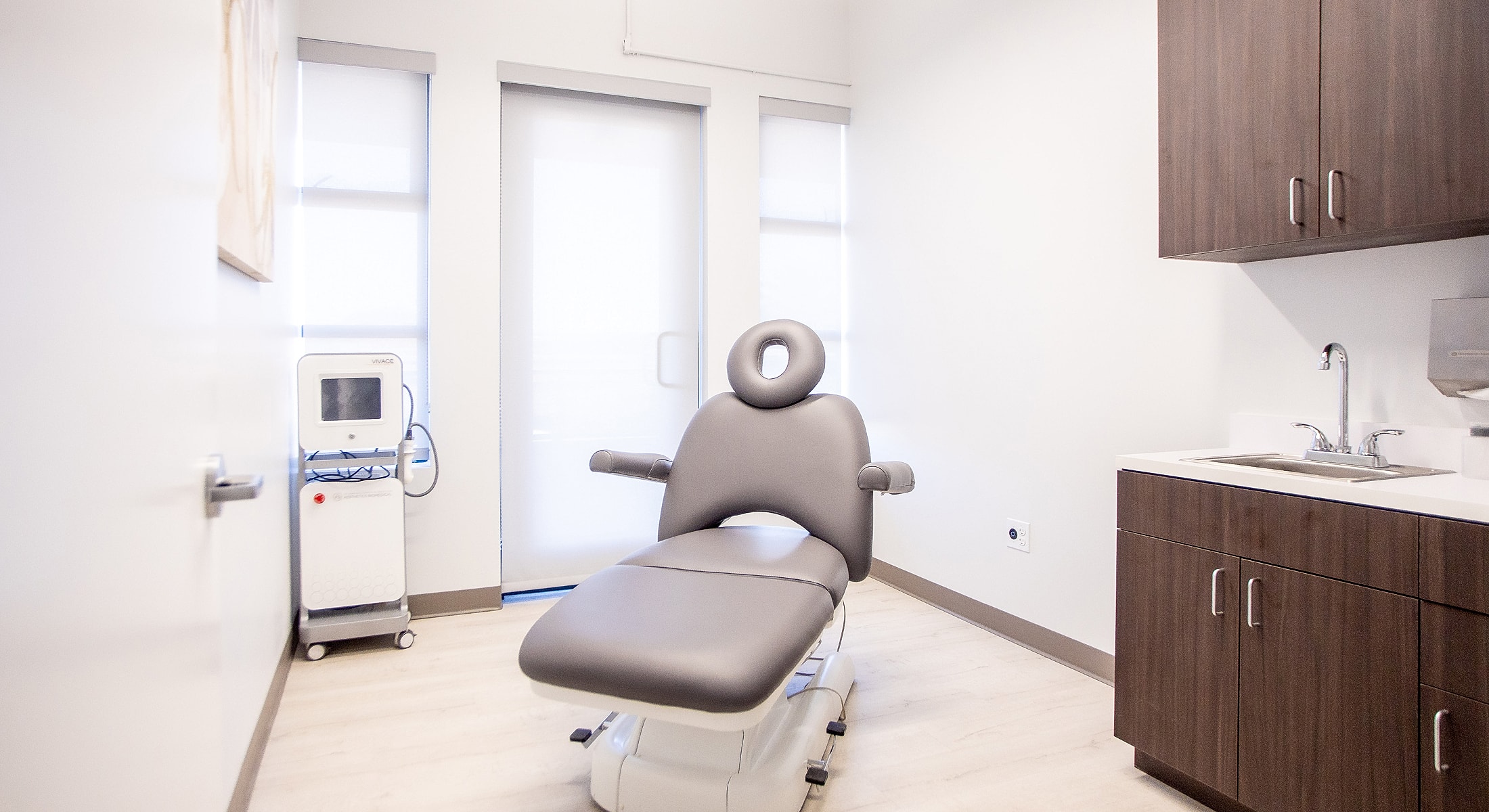 Medical examination room with adjustable chair.