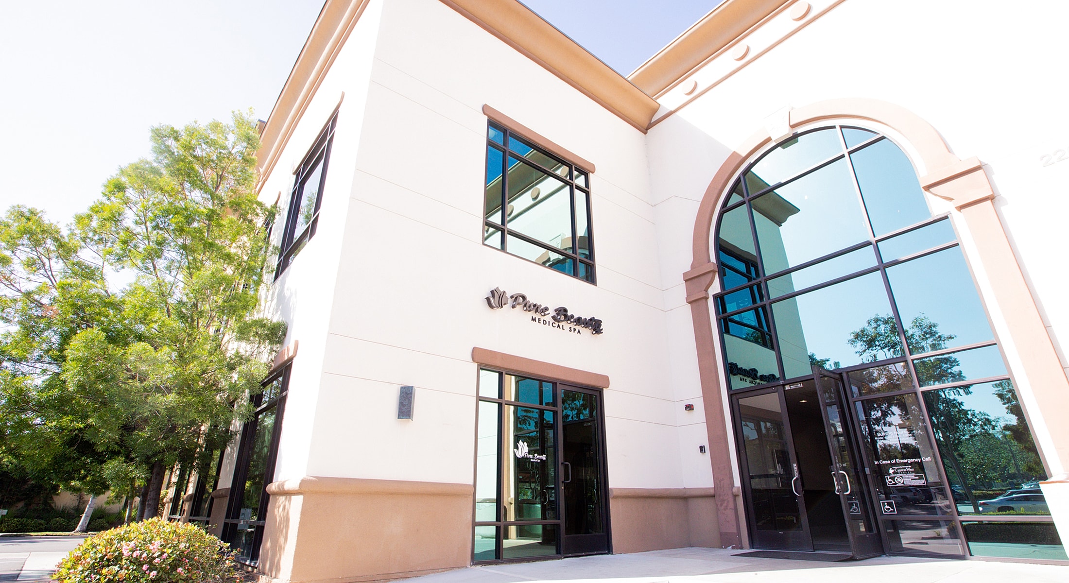 Medical spa building exterior with glass windows.
