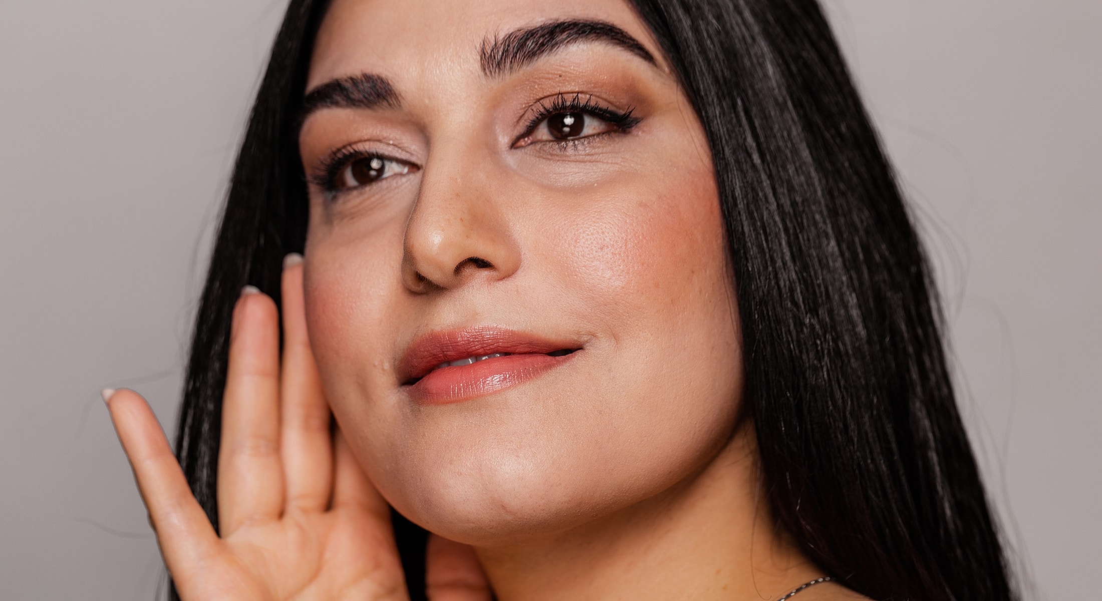 Rancho Santa Margarita Genesis Laser Skin Therapy model with long hair and natural makeup.