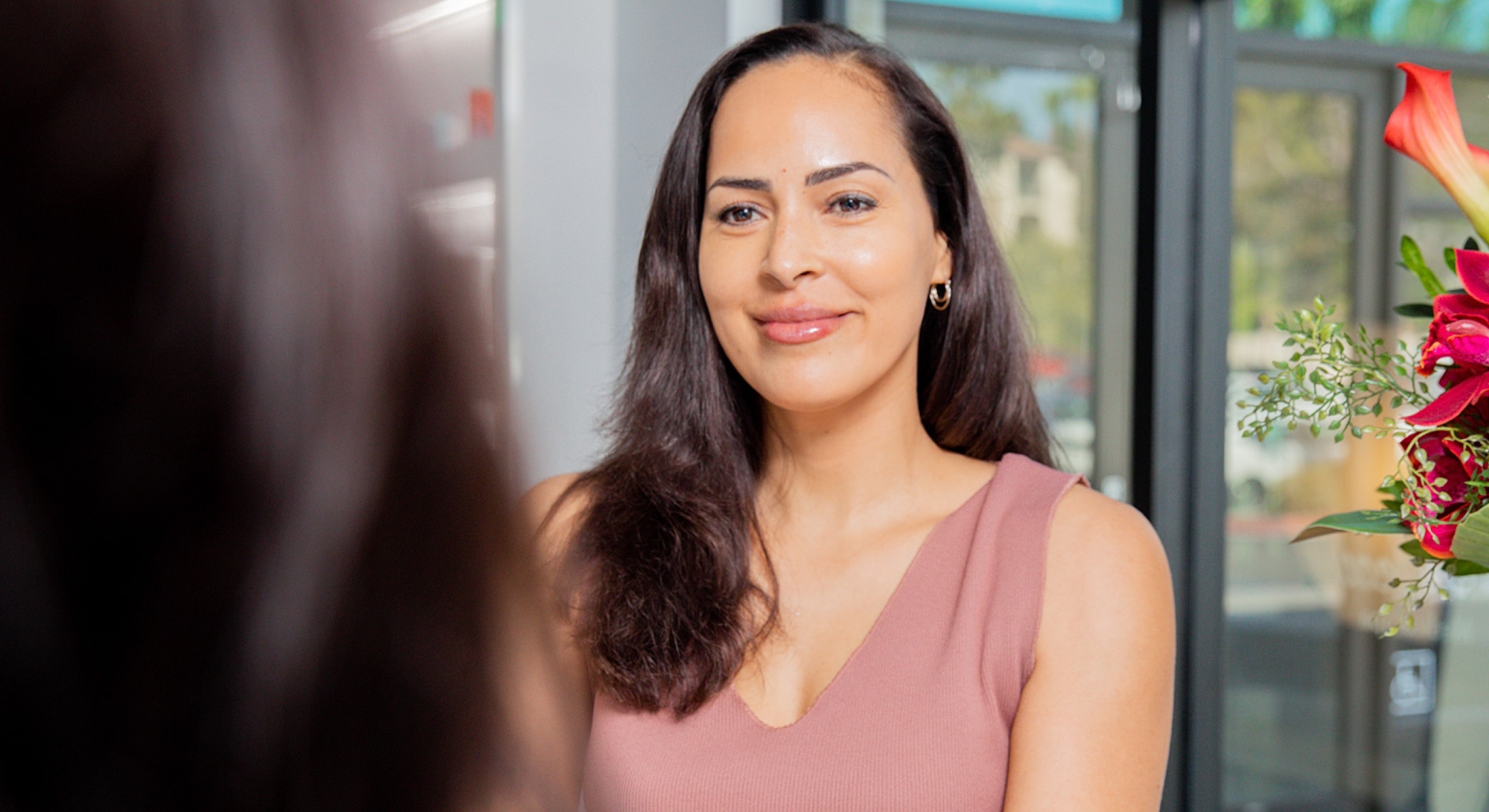 Smiling woman touching her face, natural beauty.