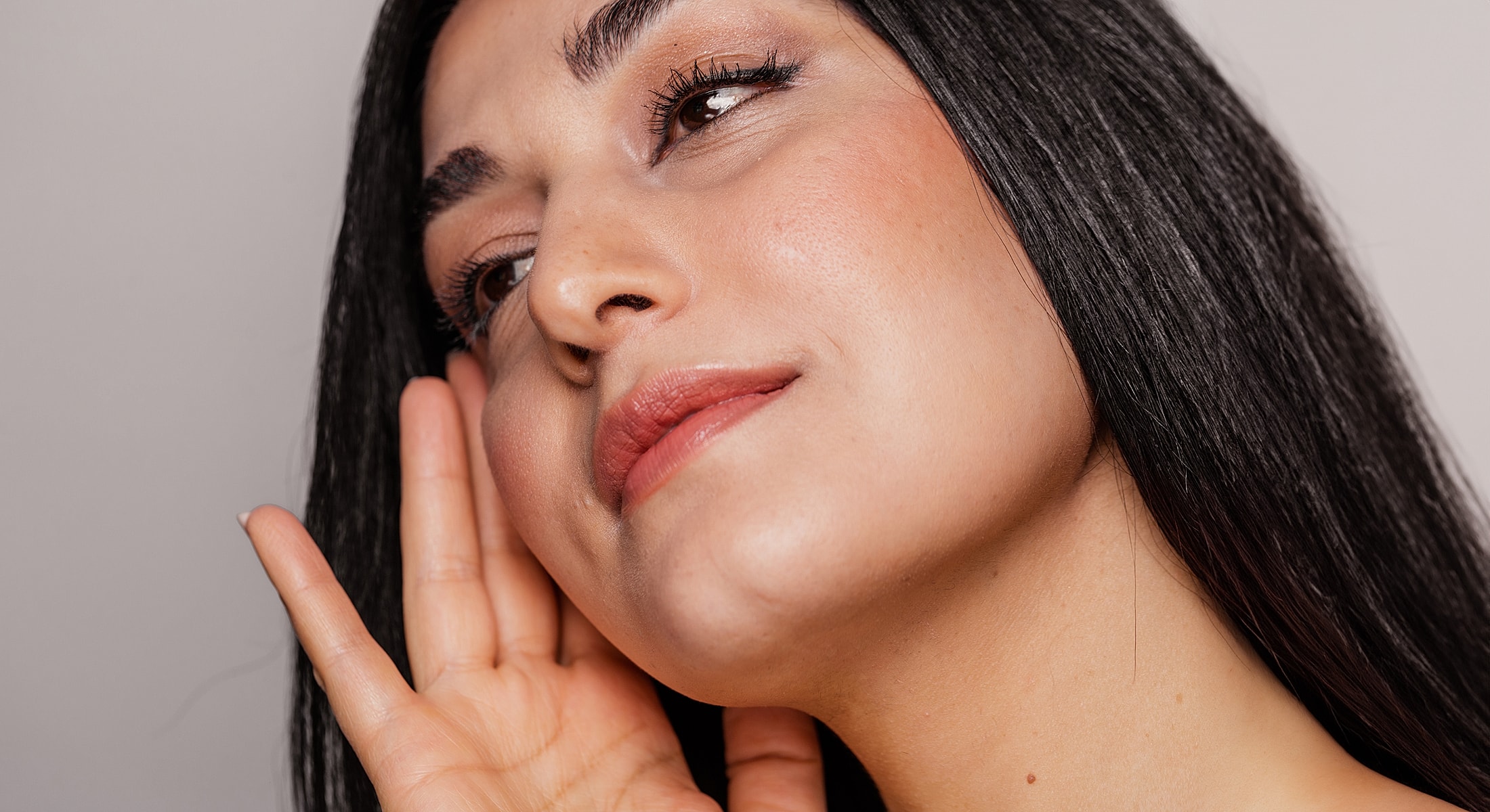Woman with long hair listening attentively.