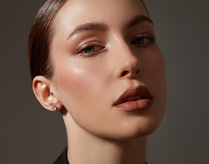 Close-up of a woman with elegant makeup.